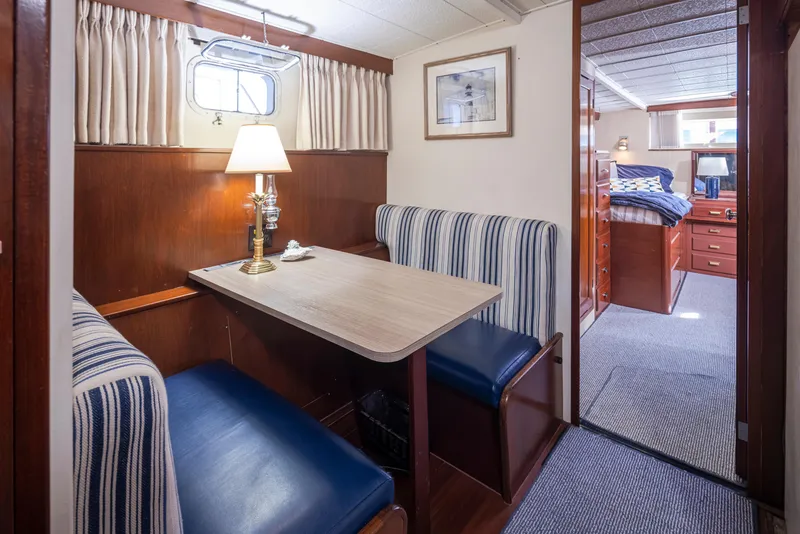 Slide: The Image of Interior of a 1965 Stephens Flushdeck yacht with dining area. - 33