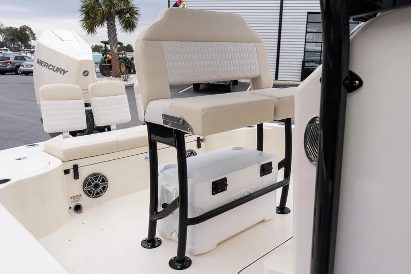 Slide: The Image of 2026 Scout 231 XSB boat interior with seating and storage, featuring a Mercury engine. - 14