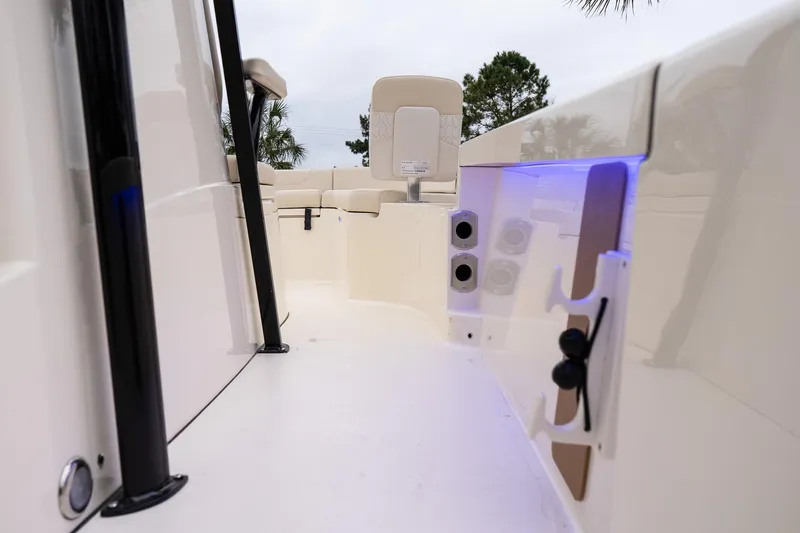 Slide: The Image of 2026 Scout 231 XSB boat interior with sleek design and ambient blue lighting. - 19