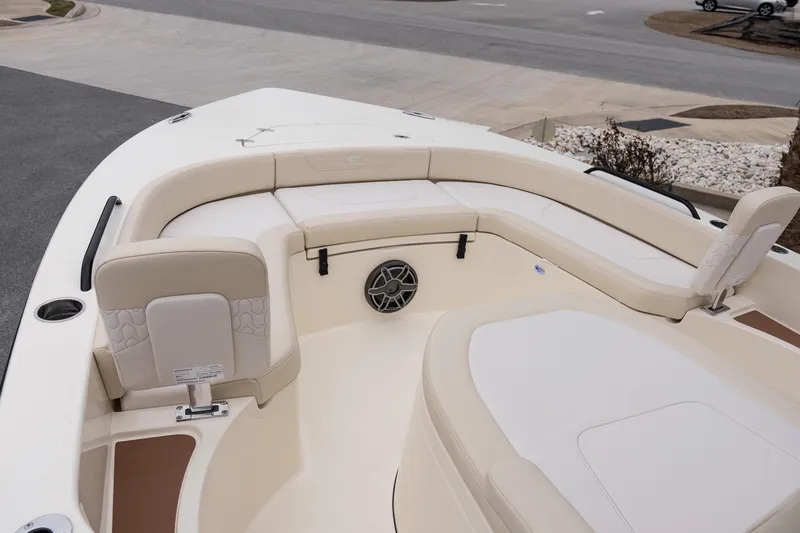 Slide: The Image of 2026 Scout 231 XSB boat interior with beige seating and modern design. - 22