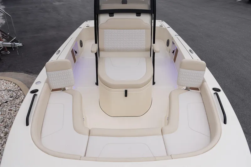 Slide: The Image of 2026 Scout 231 XSB boat interior with beige seating and modern design. - 23