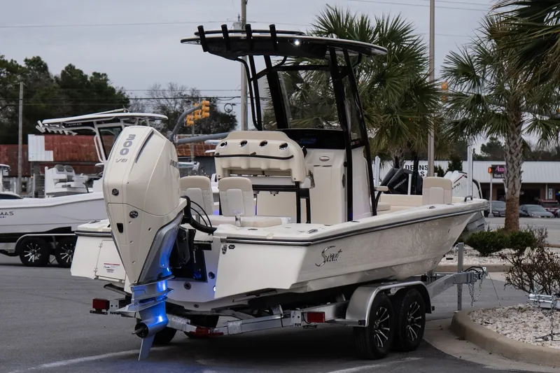 Slide: The Image of 2026 Scout 231 XSB boat on trailer, featuring powerful 300 HP engine. - 7
