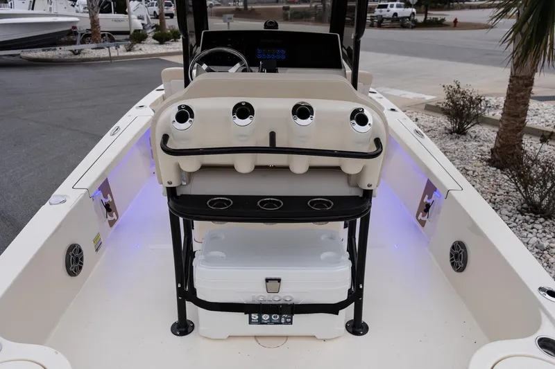 Slide: The Image of 2026 Scout 231 XSB boat interior with console and seating, featuring modern design elements. - 8