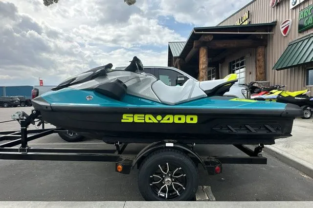 The Image of 2026 Sea-Doo GTI jet ski on trailer outside a building. - 1