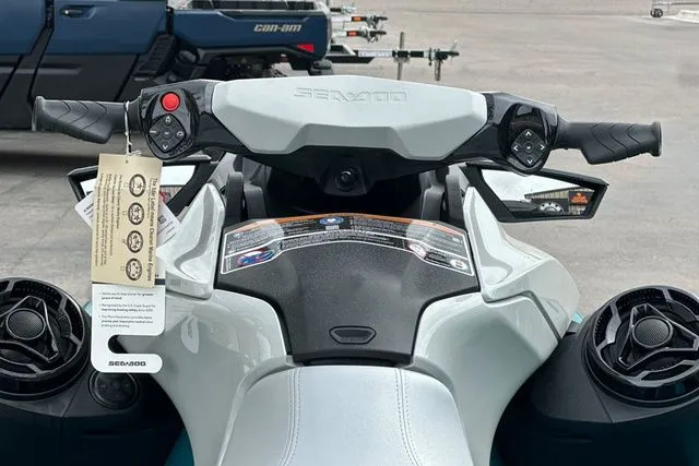 Slide: The Image of Handlebars of a 2026 Sea-Doo GTI jet ski with controls and tag. - 13