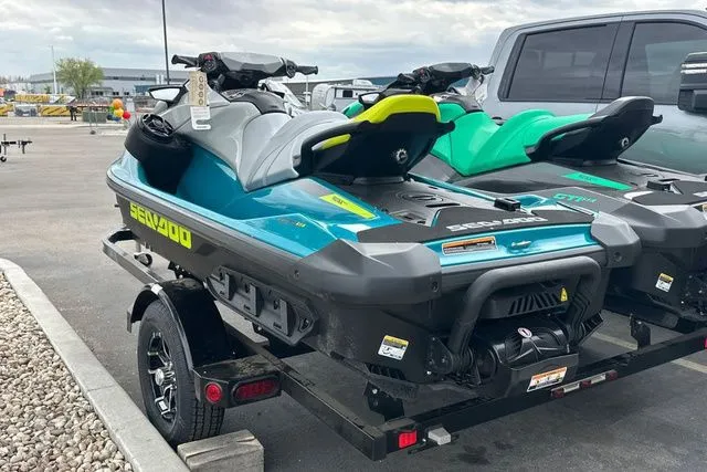 Slide: The Image of 2026 Sea-Doo GTI jet ski on trailer, blue and green. - 22