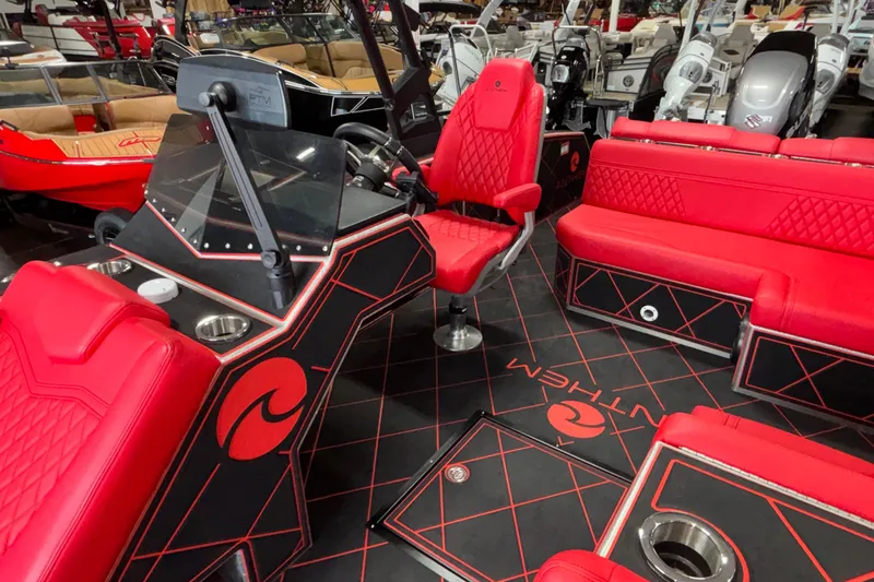 Slide: The Image of Luxurious red interior of 2026 Anthem Assault VF23 boat with modern seating and dashboard. - 10