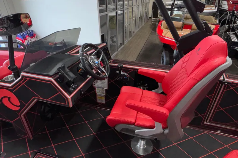 Slide: The Image of Red interior of 2026 Anthem Assault VF23 boat with modern steering and seating. - 13