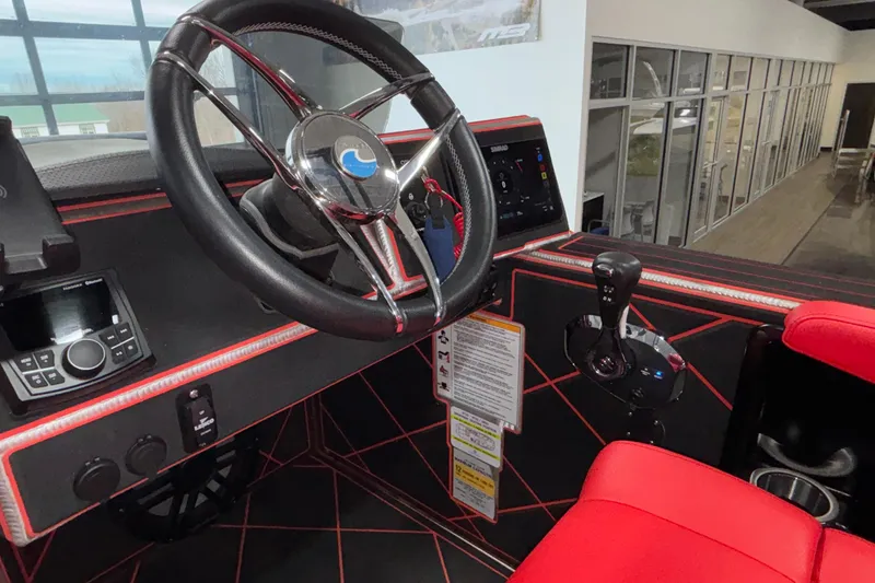 Slide: The Image of 2026 Anthem Assault VF23 boat cockpit with steering wheel and control panel. - 14