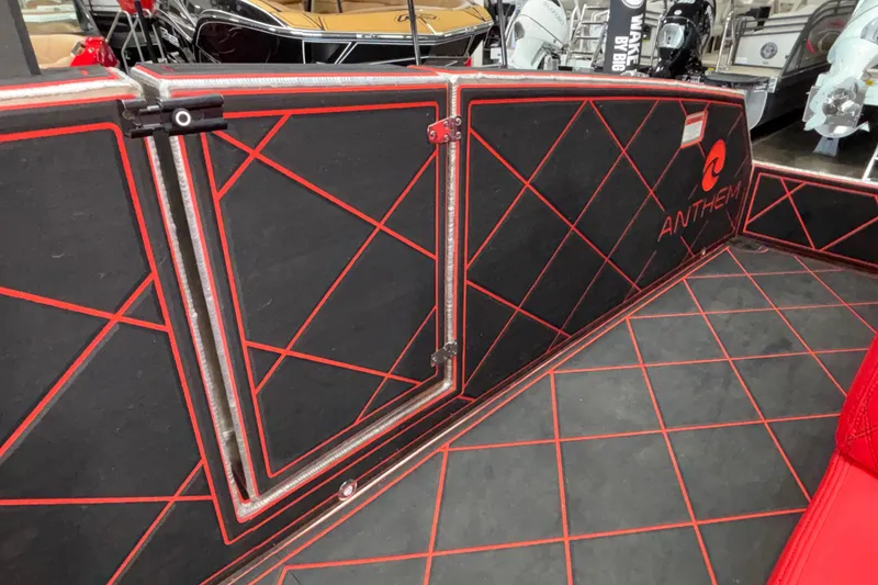 Slide: The Image of 2026 Anthem Assault VF23 interior with red and black geometric design. - 17