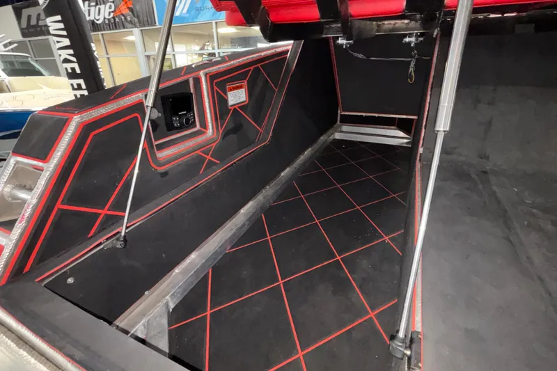 Slide: The Image of Interior of 2026 Anthem Assault VF23 boat with red and black geometric design. - 20