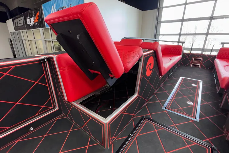 Slide: The Image of Interior of 2026 Anthem Assault VF23 boat with red seating and geometric design. - 23