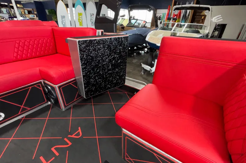 Slide: The Image of Red interior seating of 2026 Anthem Assault VF23 boat, with modern design and black accents. - 24