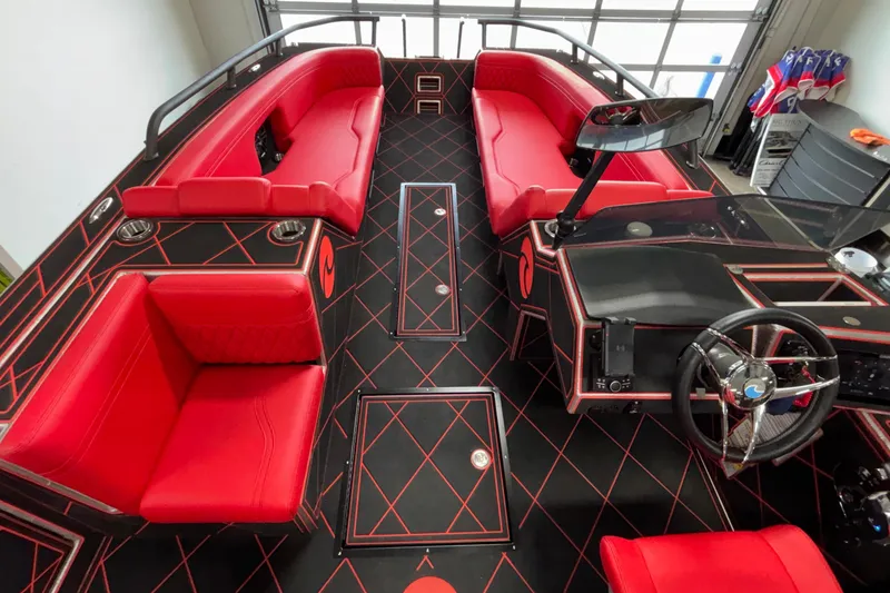 Slide: The Image of Luxurious 2026 Anthem Assault VF23 boat interior with red seating and modern dashboard design. - 26