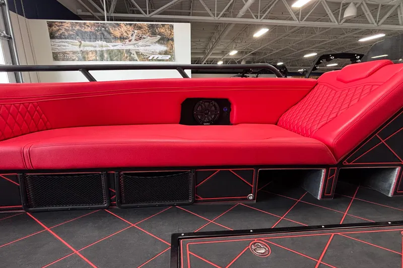 Slide: The Image of Red interior seating of 2026 Anthem Assault VF23 boat with diamond stitching and speaker. - 27