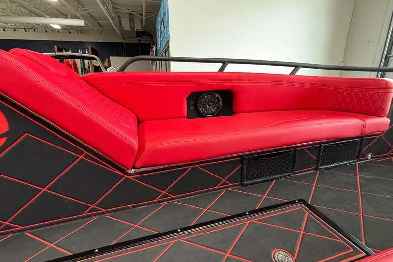 Slide: The Image of Red leather seating in 2026 Anthem Assault VF23 with black accents and speaker. - 28