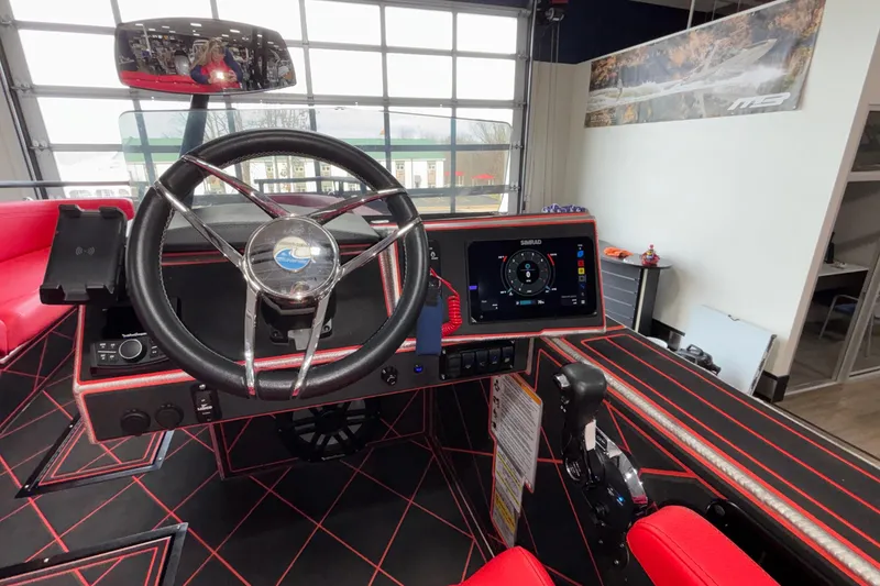 Slide: The Image of Cockpit of 2026 Anthem Assault VF23 boat with modern steering and digital display. - 3