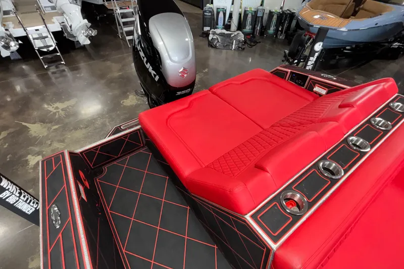 Slide: The Image of Red and black interior of 2026 Anthem Assault VF23 boat with Suzuki engine. - 4