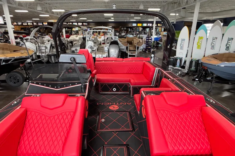 Slide: The Image of 2026 Anthem Assault VF23 boat with red seating in showroom. - 9