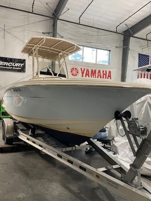 The Image of 2022 Scout 215 XSF boat on trailer in warehouse. - 0