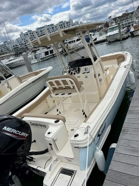 Slide: The Image of Scout 215 XSF 2022 boat docked at marina. - 11