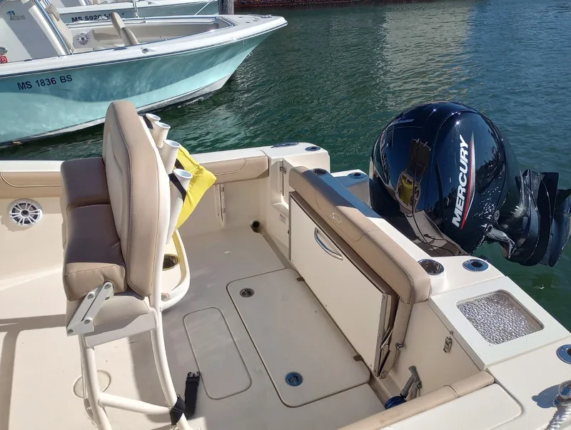 Slide: The Image of Scout 215 XSF 2022 boat with Mercury engine on water. - 13