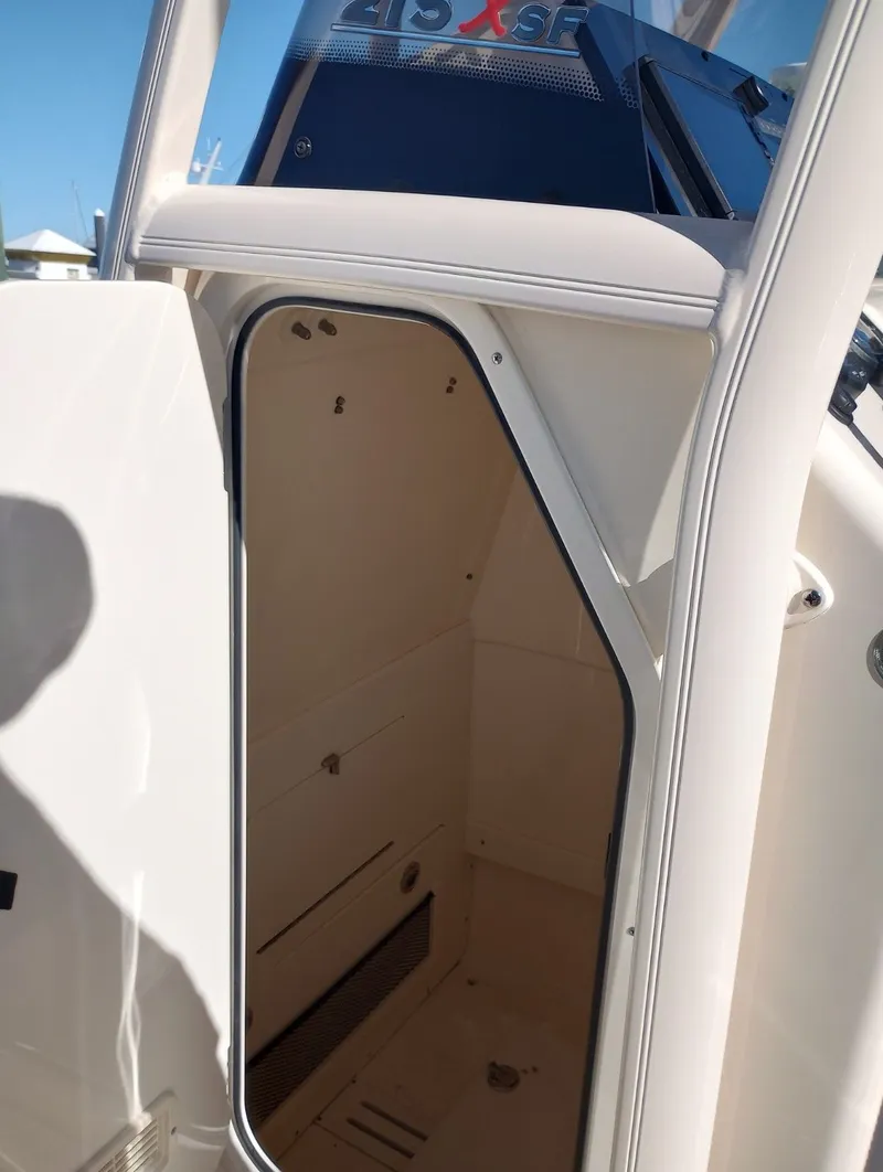 Slide: The Image of Scout 215 XSF 2022 boat cabin with open door. - 16
