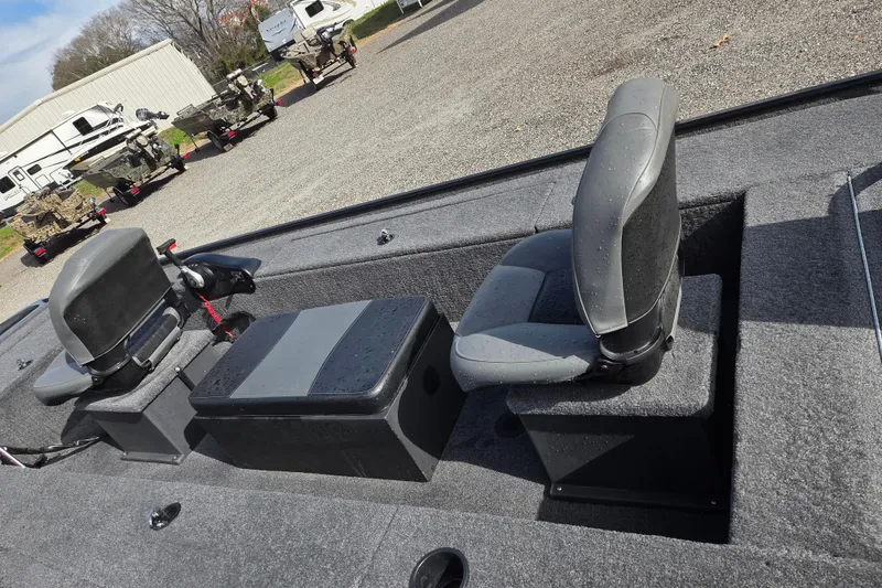 Slide: The Image of 2025 Tracker Panfish 17 boat interior with gray seating and storage compartments. - 14