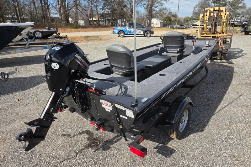 Slide: The Image of 2025 Tracker Panfish 17 boat with Mercury engine on trailer in outdoor setting. - 5