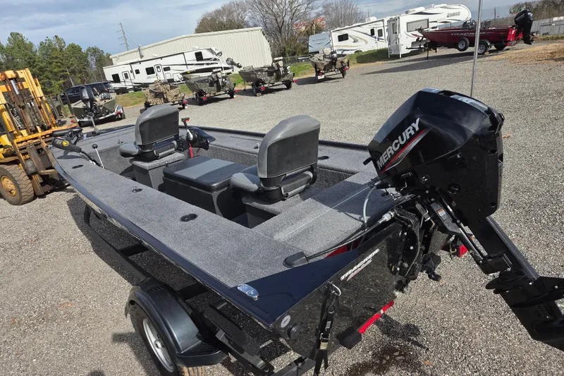 Slide: The Image of 2025 Tracker Panfish 17 boat with Mercury engine in outdoor dealership lot. - 7