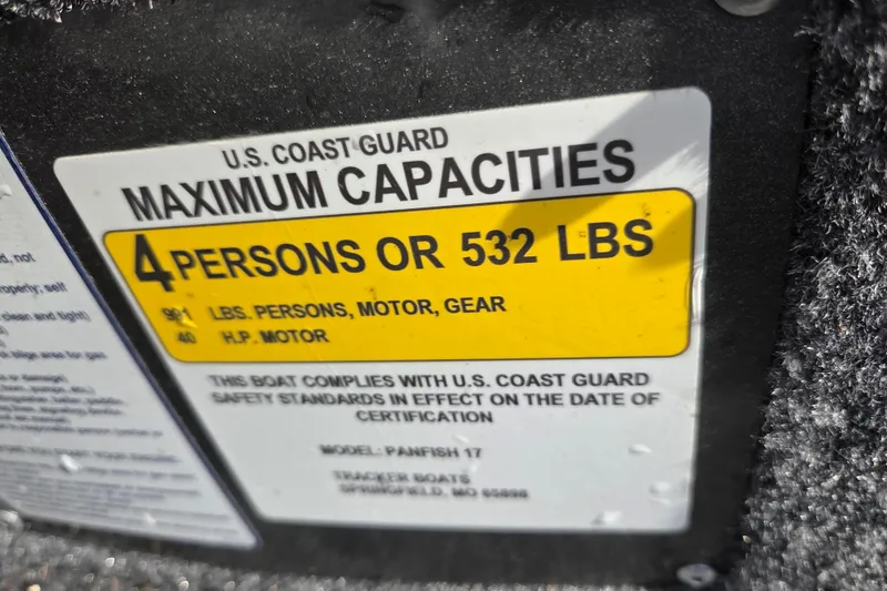 Slide: The Image of 2025 Tracker Panfish 17 boat capacity label: 4 persons or 532 lbs, U.S. Coast Guard compliant. - 8