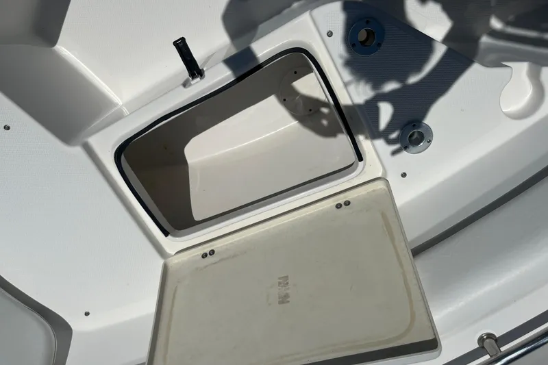 Slide: The Image of Open storage compartment on a 2014 Sea Fox 226 Commander boat deck. - 13
