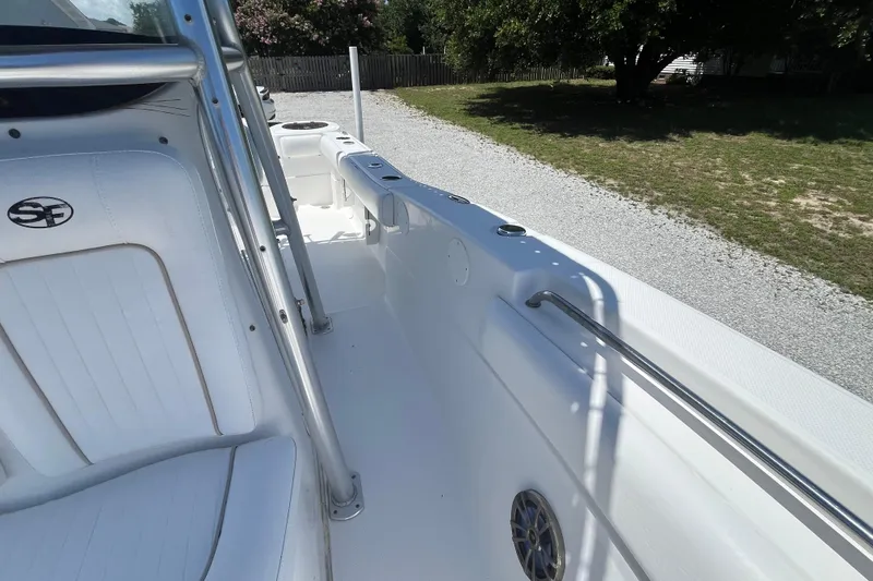 Slide: The Image of 2014 Sea Fox 226 Commander boat interior with white seating and stainless steel railings. - 17