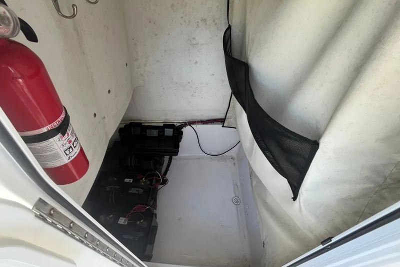 Slide: The Image of 2014 Sea Fox 226 Commander interior with fire extinguisher and battery compartment. - 20
