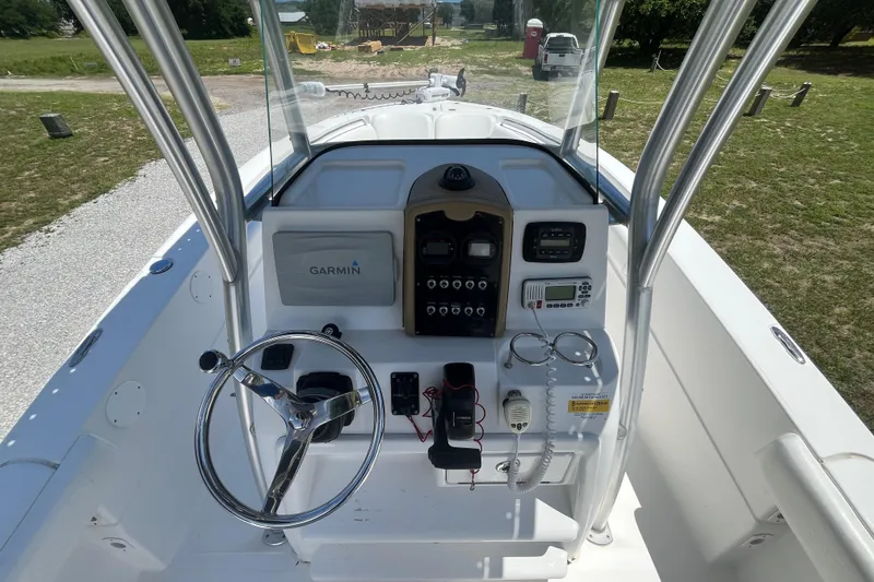 Slide: The Image of 2014 Sea Fox 226 Commander boat console with Garmin navigation and steering wheel. - 22