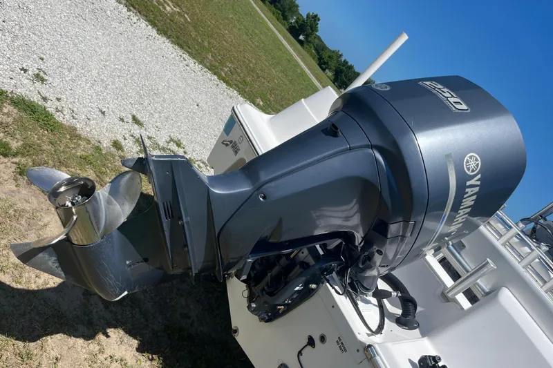 Slide: The Image of 2014 Sea Fox 226 Commander with Yamaha 250 outboard motor, parked on grass. - 31