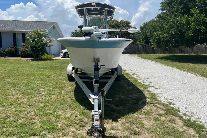 Slide: The Image of 2014 Sea Fox 226 Commander boat on trailer in a grassy yard. - 8