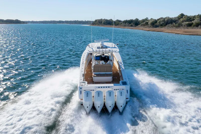 Slide: The Image of 2020 Blackwater 41 Tournament boat cruising on open water, rear view. - 11