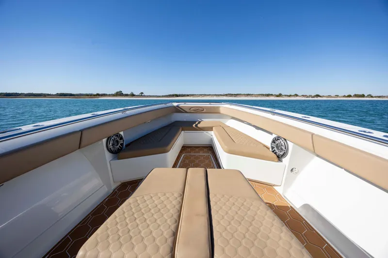 Slide: The Image of 2020 Blackwater 41 Tournament boat interior with tan seating and ocean view. - 12
