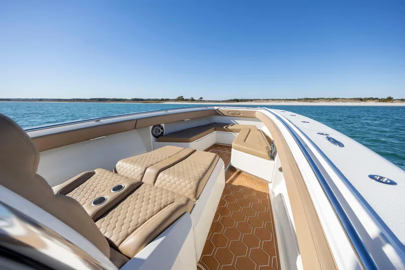 Slide: The Image of 2020 Blackwater 41 Tournament boat interior with tan seating on open water. - 14