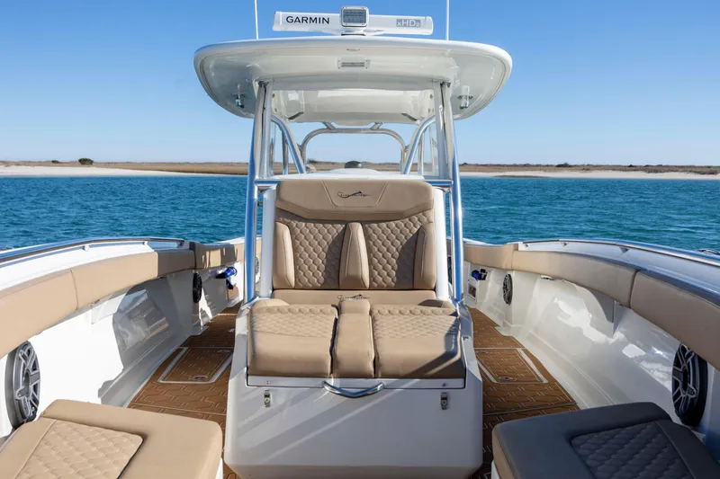 Slide: The Image of Luxury seating on a 2020 Blackwater 41 Tournament boat, cruising in clear blue waters. - 19