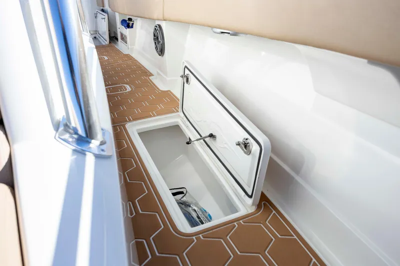 Slide: The Image of 2020 Blackwater 41 Tournament boat interior with open storage compartment and patterned flooring. - 22