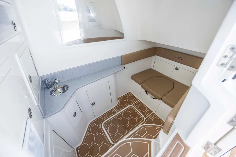 Slide: The Image of 2020 Blackwater 41 Tournament cabin interior with sink, seating, and storage. - 24