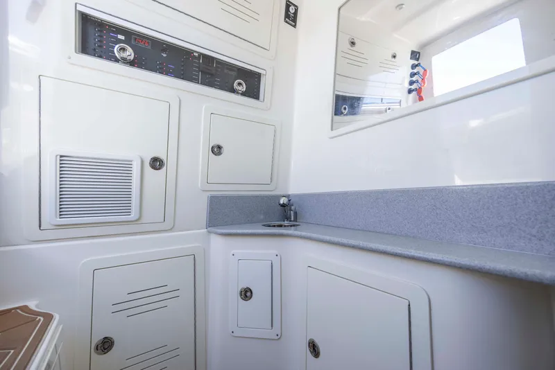 Slide: The Image of Interior of 2020 Blackwater 41 Tournament boat with control panel and sink. - 26