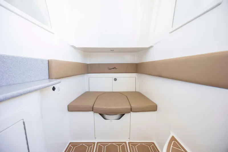 Slide: The Image of 2020 Blackwater 41 Tournament cabin interior with beige seating and white walls. - 27