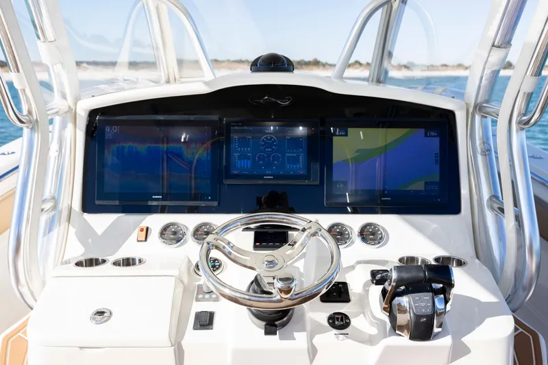 Slide: The Image of 2020 Blackwater 41 Tournament boat dashboard with advanced navigation displays and controls. - 34