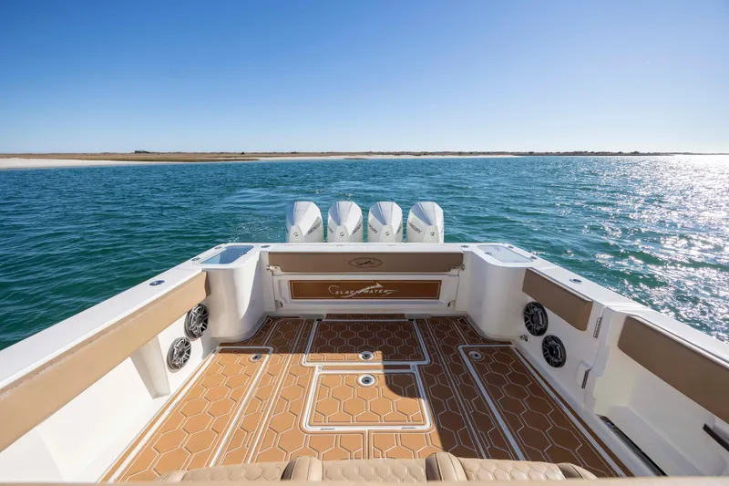 Slide: The Image of 2020 Blackwater 41 Tournament boat on open water, showcasing spacious deck and powerful engines. - 39