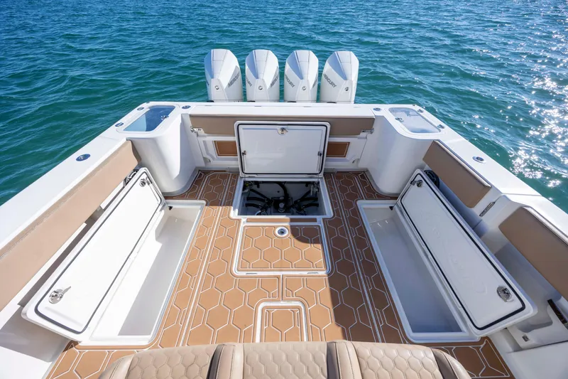 Slide: The Image of 2020 Blackwater 41 Tournament boat deck with storage compartments and four outboard engines. - 40