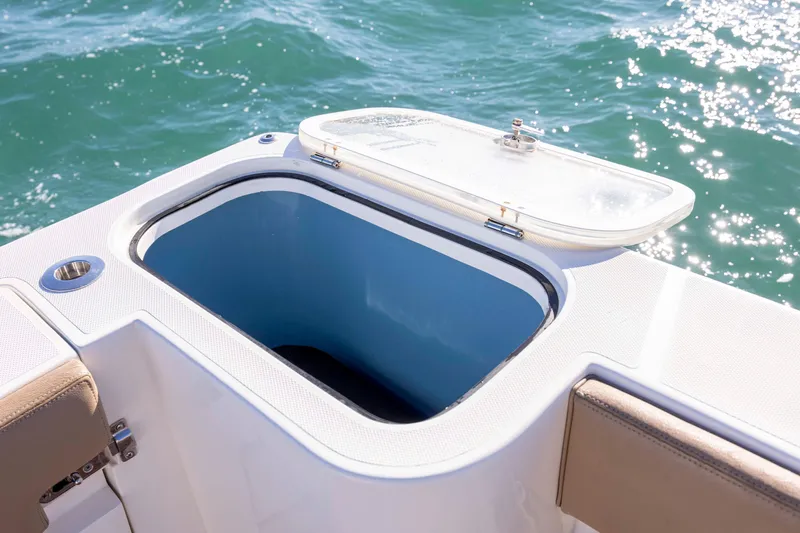 Slide: The Image of Open storage compartment on 2020 Blackwater 41 Tournament boat, with ocean background. - 42