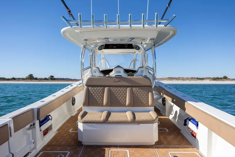Slide: The Image of 2020 Blackwater 41 Tournament boat interior with seating, ocean view, and clear sky. - 44